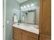 Bathroom features vanity with storage, modern fixtures, and neutral paint at 2118 S Mobile Way, Aurora, CO 80013