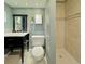 Bright bathroom boasts modern fixtures, vanity with storage, and walk-in shower at 2118 S Mobile Way, Aurora, CO 80013