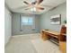 Bedroom with light-grey walls, neutral carpet, and a window with street view at 2118 S Mobile Way, Aurora, CO 80013