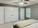 Neutral bedroom features a ceiling fan, large closet and soft, natural light at 2118 S Mobile Way, Aurora, CO 80013