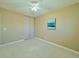 Neutral bedroom featuring plush carpeting, a ceiling fan, and sliding closet doors at 2118 S Mobile Way, Aurora, CO 80013