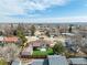 Spacious backyard with artificial turf, complemented by a large storage shed and partially covered patio at 6343 Depew St, Arvada, CO 80003