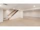 Spacious carpeted basement includes staircase and additional living space at 6343 Depew St, Arvada, CO 80003