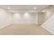 Large carpeted basement with ample lighting and plenty of room for activities at 6343 Depew St, Arvada, CO 80003