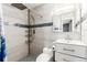 Modern bathroom with a walk-in shower and stylish vanity at 6343 Depew St, Arvada, CO 80003