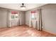 Cozy bedroom with hardwood floors, natural light, and neutral color scheme at 6343 Depew St, Arvada, CO 80003