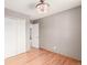 This bedroom offers natural light, hardwood floors, and a spacious closet at 6343 Depew St, Arvada, CO 80003