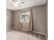 The cozy bedroom is filled with soft natural light and offers neutral tones at 6343 Depew St, Arvada, CO 80003
