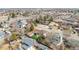 Aerial view featuring the home, a fenced yard, nearby amenities, and community access at 6343 Depew St, Arvada, CO 80003