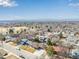 Wide aerial view of the property's location within a peaceful residential neighborhood, near open fields and recreation areas at 6343 Depew St, Arvada, CO 80003