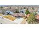 Aerial view of a lovely single-story house with a long driveway and a well-kept lawn in a quiet neighborhood at 6343 Depew St, Arvada, CO 80003
