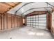 Spacious, unfinished detached garage with high ceilings, perfect for storage or workshop at 6343 Depew St, Arvada, CO 80003