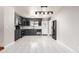 Spacious kitchen with modern appliances, sleek countertops, and ample cabinet storage at 6343 Depew St, Arvada, CO 80003