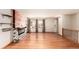 Inviting living room with hardwood floors, a fireplace, and bright natural light at 6343 Depew St, Arvada, CO 80003