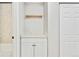 White vanity with a quartz countertop and built-in shelving at 2707 Valmont Rd # 106B, Boulder, CO 80304