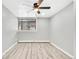 Bright bedroom with wood-look floors and ceiling fan at 2707 Valmont Rd # 106B, Boulder, CO 80304