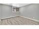 Spacious bedroom with grey walls and light wood flooring at 2707 Valmont Rd # 106B, Boulder, CO 80304