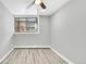 Bright bedroom with wood-look floors and ceiling fan at 2707 Valmont Rd # 106B, Boulder, CO 80304