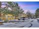 Snow-covered exterior of an apartment building with parking lot and landscaping at 2707 Valmont Rd # 106B, Boulder, CO 80304