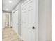 Bright hallway with white doors and grey walls at 2707 Valmont Rd # 106B, Boulder, CO 80304