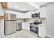 Modern white kitchen with stainless steel appliances at 2707 Valmont Rd # 106B, Boulder, CO 80304