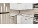 Modern kitchen with white cabinets and stainless steel appliances at 2707 Valmont Rd # 106B, Boulder, CO 80304