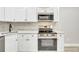 Modern kitchen with white cabinets and stainless steel appliances at 2707 Valmont Rd # 106B, Boulder, CO 80304