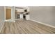 Open concept living room with kitchen and hardwood floors at 2707 Valmont Rd # 106B, Boulder, CO 80304