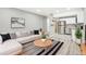 Open living room featuring L-shaped sofa and modern coffee table at 2707 Valmont Rd # 106B, Boulder, CO 80304