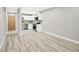 Open concept living room with kitchen and hardwood floors at 2707 Valmont Rd # 106B, Boulder, CO 80304