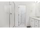 Clean bathroom featuring a glass-enclosed shower, marble floors, and a vanity with modern fixtures at 6912 Huddersfield Ln, Castle Pines, CO 80108