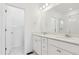Clean bathroom with double sinks, marble floors, and a glass-enclosed shower at 6912 Huddersfield Ln, Castle Pines, CO 80108