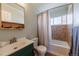 Cozy bathroom featuring a tiled shower-tub, updated vanity, and ample natural light at 3310 W 95Th Ave, Westminster, CO 80031