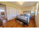 Comfortable bedroom featuring natural light, hardwood floors, and ample storage at 3310 W 95Th Ave, Westminster, CO 80031