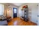 Bright foyer featuring hardwood floors and a convenient storage shelf at 3310 W 95Th Ave, Westminster, CO 80031