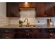 Close up shot of an updated kitchen featuring granite countertops and tiled backsplash at 3310 W 95Th Ave, Westminster, CO 80031