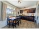 Bright eat-in kitchen with wood cabinets, subway tile backsplash, and stainless-steel appliances at 3310 W 95Th Ave, Westminster, CO 80031