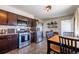 Well-appointed kitchen with stainless steel appliances, eat-in area, and stylish decor at 3310 W 95Th Ave, Westminster, CO 80031