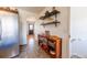 Functional kitchen entryway featuring stylish display shelves and convenient access to other areas at 3310 W 95Th Ave, Westminster, CO 80031