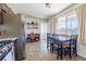 Bright eat-in kitchen with stainless steel appliances and adjacent pantry shelving at 3310 W 95Th Ave, Westminster, CO 80031