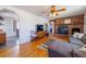 Cozy living room with a brick fireplace and hardwood flooring at 3310 W 95Th Ave, Westminster, CO 80031