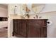 Bathroom featuring a vanity with dual sinks and decorative mirrors at 5215 S Washington St, Littleton, CO 80121