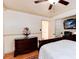 Bedroom with a mounted TV, closet, and view to the bathroom at 5215 S Washington St, Littleton, CO 80121