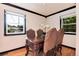 Bright dining room featuring a wood dining table, hardwood floors, and windows with views at 5215 S Washington St, Littleton, CO 80121