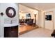 Welcoming entryway with hardwood floors leading to the living room and includes a half bath at 5215 S Washington St, Littleton, CO 80121