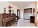 Elegant entry featuring a piano, decor, and a laundry area for added convenience at 5215 S Washington St, Littleton, CO 80121