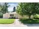 Charming single-story home with a well-maintained lawn and mature shade tree in a desirable neighborhood at 5215 S Washington St, Littleton, CO 80121