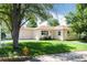Beautifully landscaped front yard featuring lush green grass and a cozy, well-maintained home at 5215 S Washington St, Littleton, CO 80121