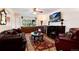 Cozy living room with a fireplace, classic furnishings, and large window at 5215 S Washington St, Littleton, CO 80121