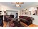 Comfortable living room featuring hardwood floors, a tufted leather sofa, and elegant decor at 5215 S Washington St, Littleton, CO 80121
